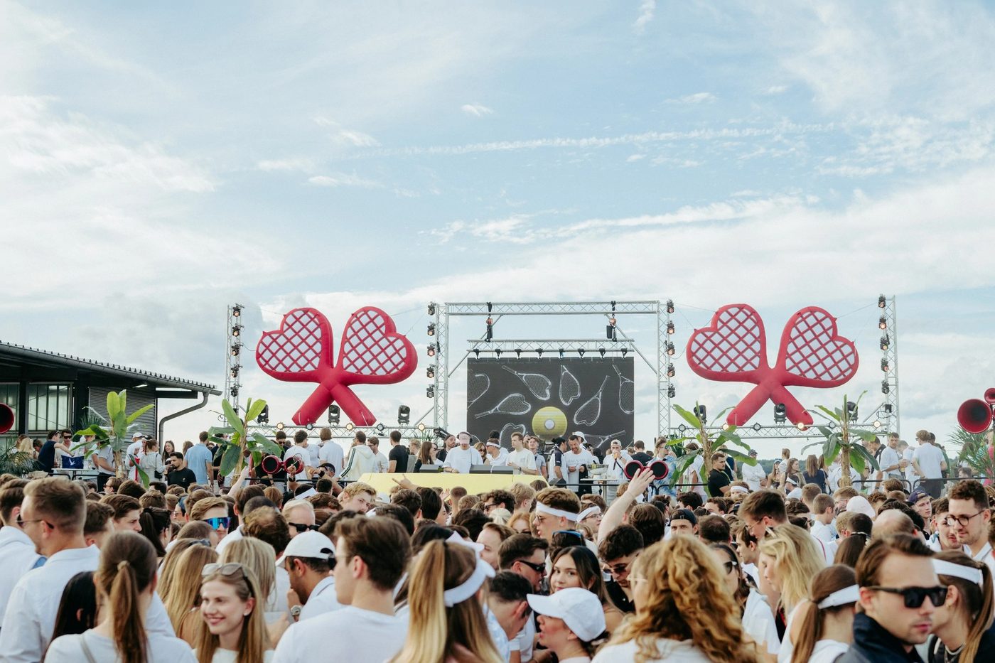 Fifteen Love Tennis Party - stage with giant racquets and crowd